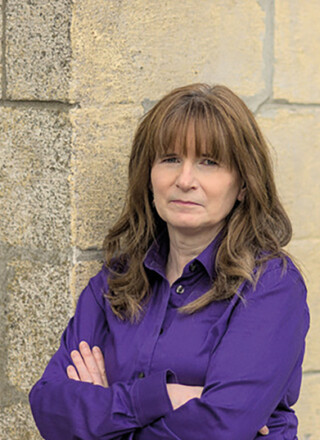 La co-auteure du rapport, Christine Saulnier, appelle le gouvernement insulaire à poursuivre ses efforts pour réduire la pauvreté.  — Photo : Gracieuseté