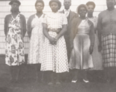 Groupe de femmes (et un homme) vêtues d’une toge de choriste, à l’Église baptiste Emmanuel, Upper Hammonds Plains. &mdash; PHOTO: C.R. Brookbank, Nova Scotia Archives
