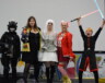 Les trois semi-finalistes dans le concours de costume solo et les deux annonceurs des gagnants. Les concurrents étant déguisé en Ghost, Dresseur de Pokémon, et personnage de Star Wars. — Photo Élodie Roy