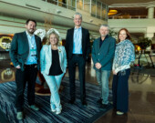 Au Roundup de Vancouver, le député Julian Morse et les ministres Caitlin Cleveland, Jay McDonald et Caroline Wawzonek entourent le premier ministre des TNO, RJ Simpson. &mdash; Courtoisie