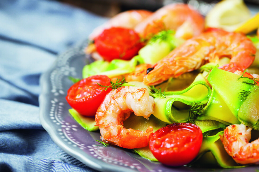 Prawns, zuchini noodles and tomato - delicious healthy food  