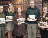 Rassemblés pour le lancement officiel du livre Cap-Rouge : ancien hameau de Chéticamp, de gauche à droite : Napoléon Chiasson, président de la Société Saint-Pierre, Kelly Deveaux, surintendante par intérim du parc national, Ginette Chiasson, recherchiste et auteure du livre, Blair Pardy, directeur de l’unité de gestion du Cap-Breton et Lisette Bourgeois, directrice générale de la Société Saint-Pierre. &mdash; Rosie AuCoin-Grace