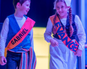 Les élèves Nico Curry et Sadie Wilson jouent les rôles d'Evangeline et de Gabriel lors du 51e Carnaval d'hiver du Pomquet, en montant sur scène lors de la soirée de danse carrée communautaire.  &mdash; PHOTO : Shannon Nickerson