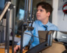 Jayden LeBlanc se prépare pour sa dernière émission de radio avant son retour en août. Le 10e épisode de «Une Veillée À Clare» a été tourné le 24 juin 2026. &mdash; PHOTO: Shannon Nickerson